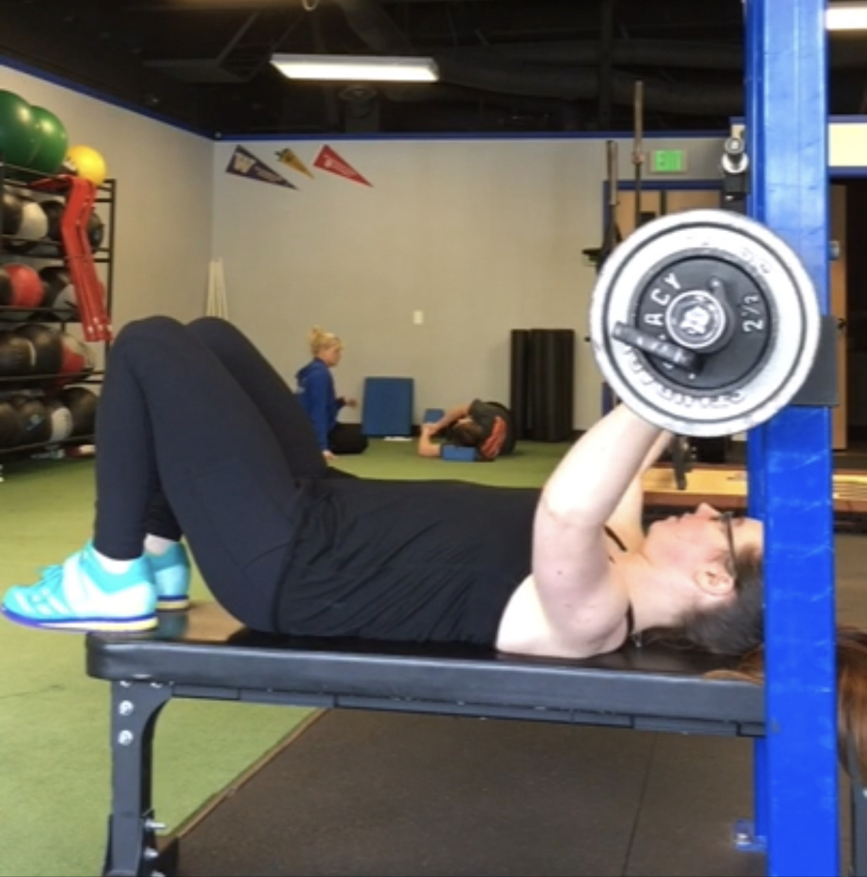 Person performing bench press with proper form