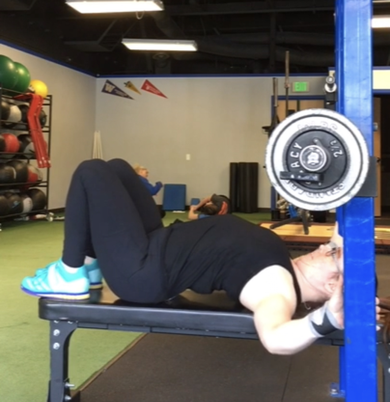 Person performing bench press with proper form