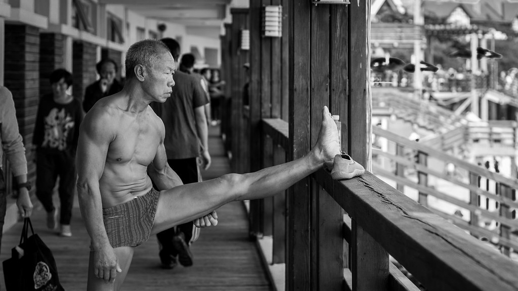 Elderly man stretching